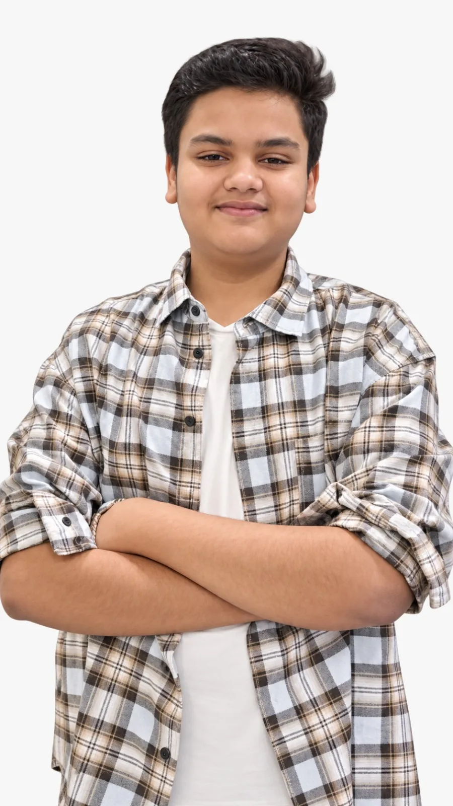 Portrait of Arnav Yuvraj K., founder of AELMIORA, smiling with arms folded, in a checked shirt